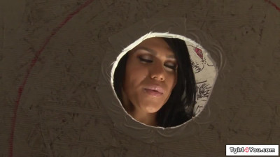 Busty tattooed tgirl Diamond Dixon gives bj in a gloryhole