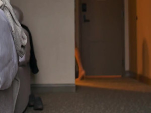 Glossy pantyhose and stilettos show and dangle