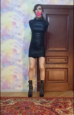 Crossdresser in armbinder gag and all other attributes