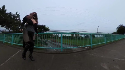 Crossdresser flashing on a highway bridge