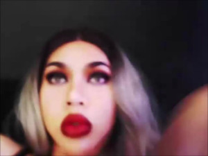 Tranny showing off her oral skills by sucking a dildo