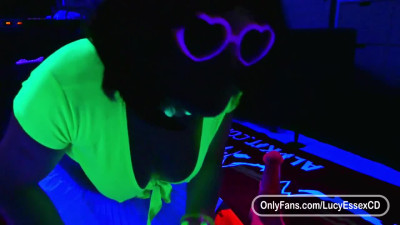 Lucy Essex CD riding a huge horse dildo in glow in the dark chastity cage