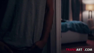 Shemale in lingerie pushed onto the bed