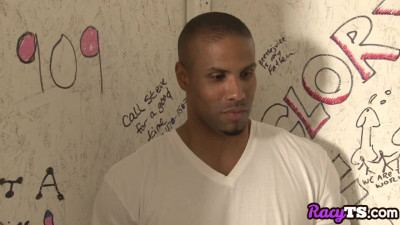 Busty tgirl sucks cock through gloryhole in interracial duo