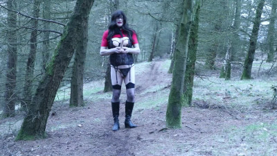 crossdresser inserting dildo outdoors