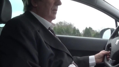 crossdresser sissy by car on the road in the parking lo