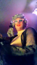 Holder smoking in satin gloves