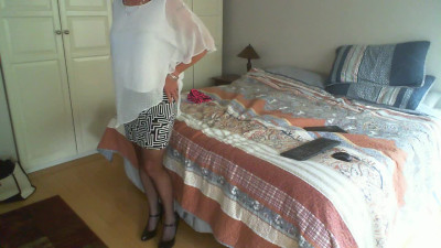 Crossdressing mature babe Terrie Daze tugs her tasty cock.
