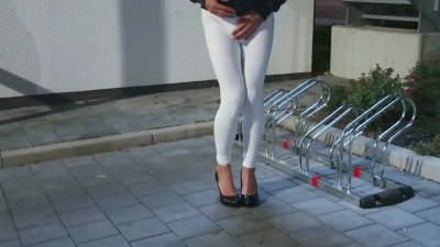 Pissing in white sexy leggings