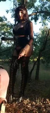 Yasmin Ferraz an her slave at the wood