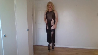 Blonde in black stockings, long dress and heels