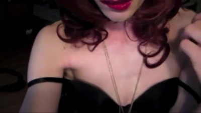 Classy redhead shemale in high heels and lingerie jerks off