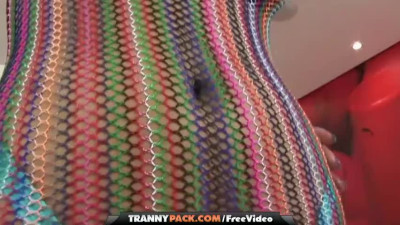 Short-haired shemale takes a cumshot all over her big tits
