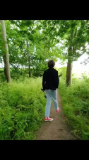Annemieke wetting herself on her hike and caught playing on a bench outdoor