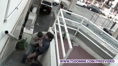 Brunette tranny in tight blue sweater gets a blowjob from a dude