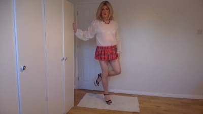 Blonde in miniskirt and nude pantyhose