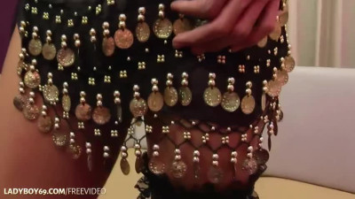 Dark-haired ladyboy strips her leopard bikini and plays with her shaved dick