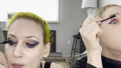 Man and Woman Putting on Mascara and Fake Lashes