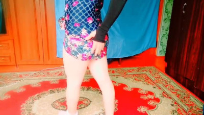 Sweet shemale dancing under string lights in backyard