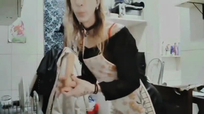 Mavka, the maid, inserting the dildo into her little ass.