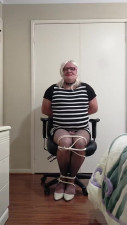 DAISY TIED TO A CHAIR IN TIGHT BLACK AND WHITE DRESS
