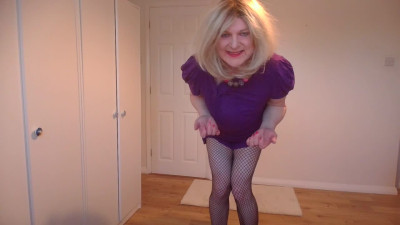 Purple minidress, no bra and fishnets
