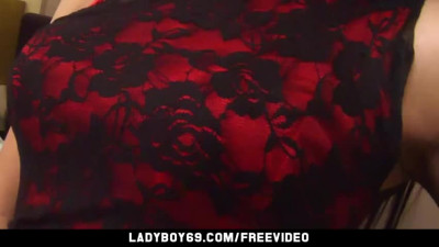 Brunette ladyboy in tight red dress teases with her small tits in bed