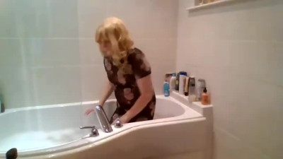 Taking a bath in a black see-through dress and no panties