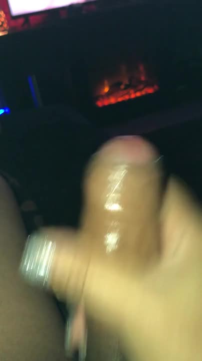 Watch Stroking her big cock and busting a nut while watching porn in front of the fireplace Shemale Porn Videos | TranSexBig.