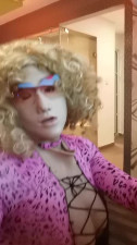 Sexy crossdresser in highheels pink bodysuit girl facemask