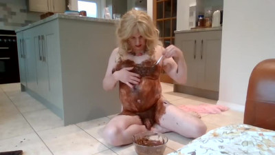 Naked blonde covered in chocolate